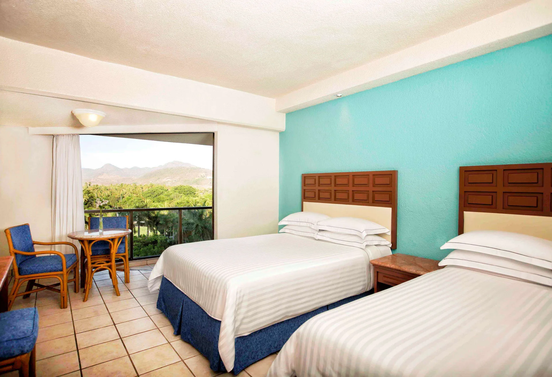Superior Room with two double beds and balcony view at Barceló Ixtapa.