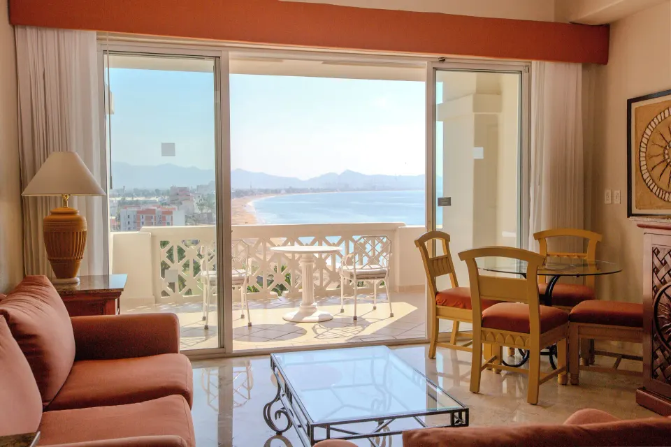 Junior Suite Premium Level balcony doors with bay view at Barceló Karmina.