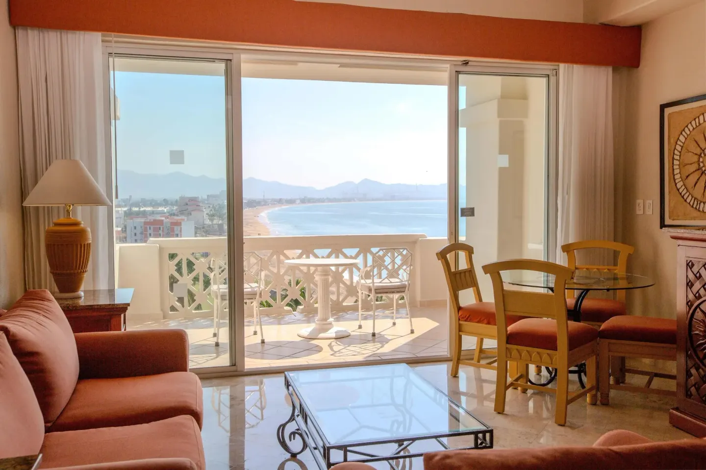 Junior Suite Premium Level seating area beside balcony doors at Barceló Karmina.
