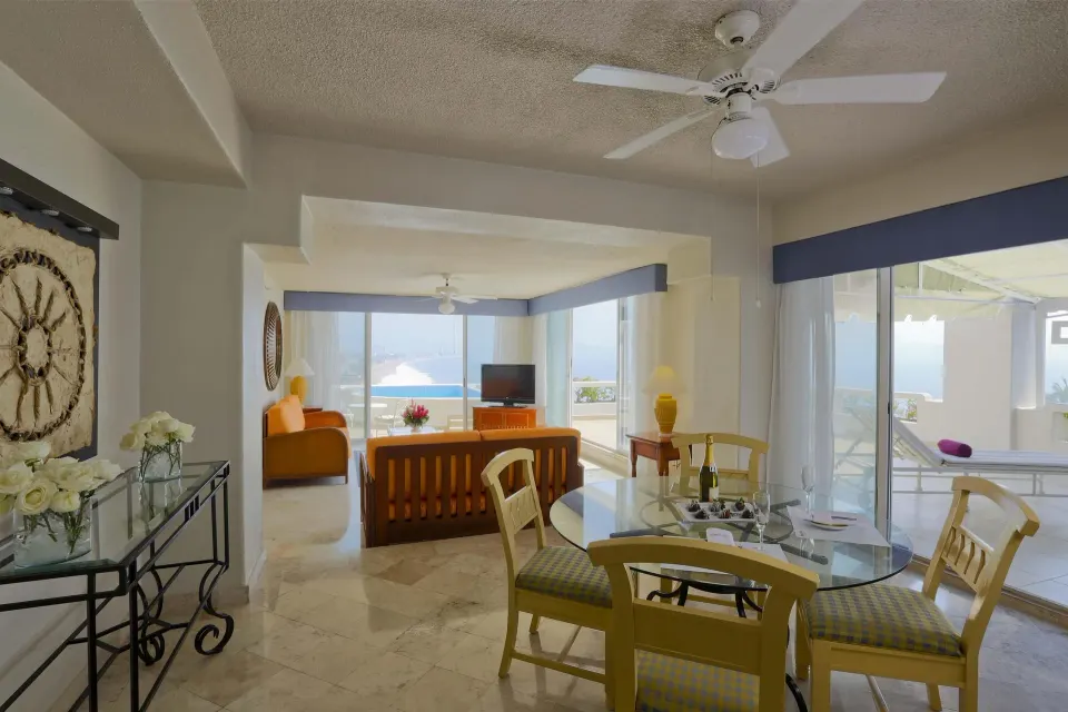 Master Suite living and dining area with terrace doors and sea view at Barceló Karmina.