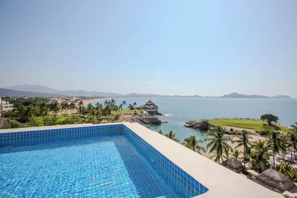 Private balcony pool overlooking the beach, palms and sea from a Master Suite at Barceló Karmina.