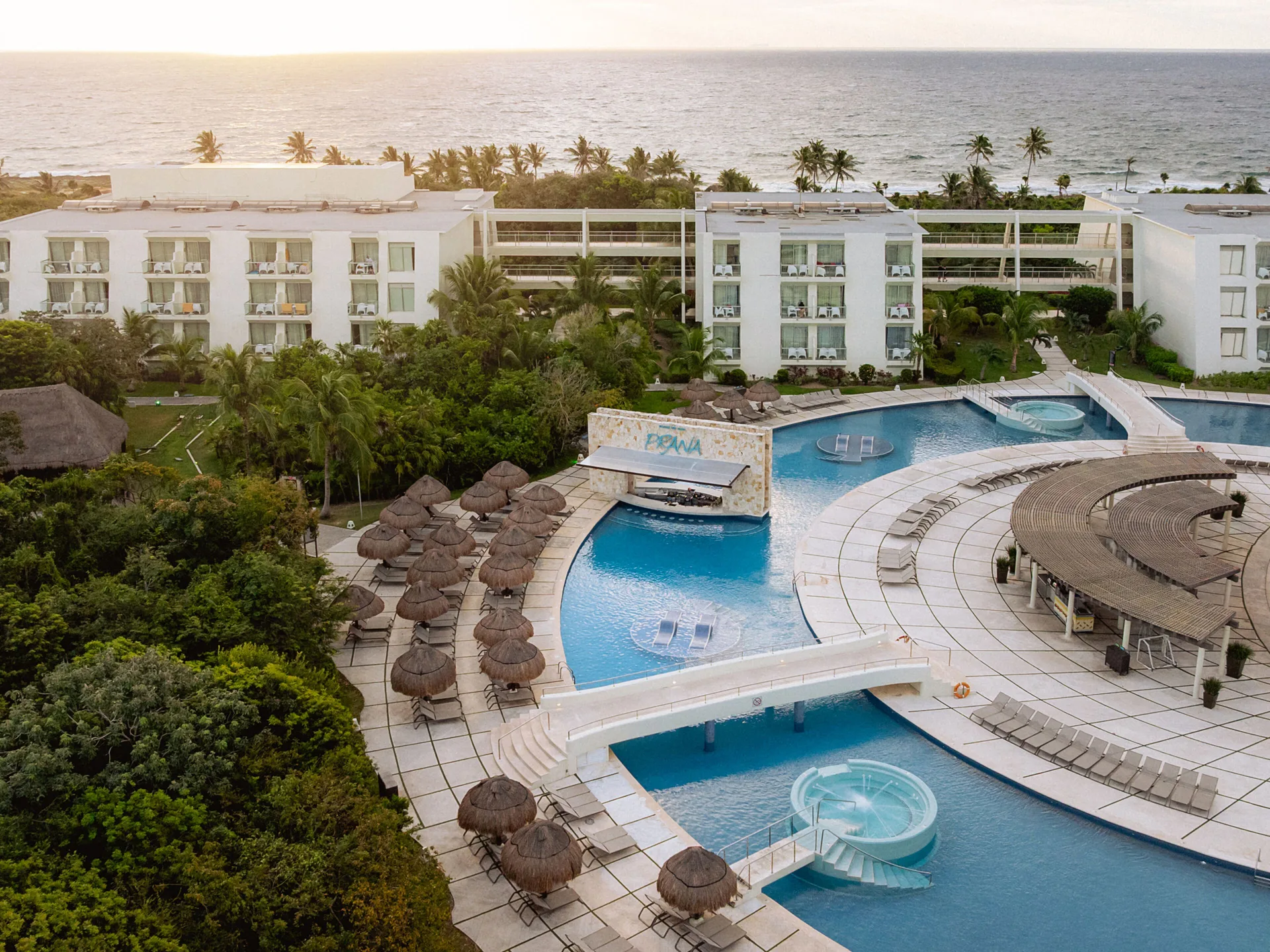 Grand Sirenis Xpu-Ha Resort & Spa all-inclusive with beachfront pools, natural cenotes, and jungle setting near Tulum.
