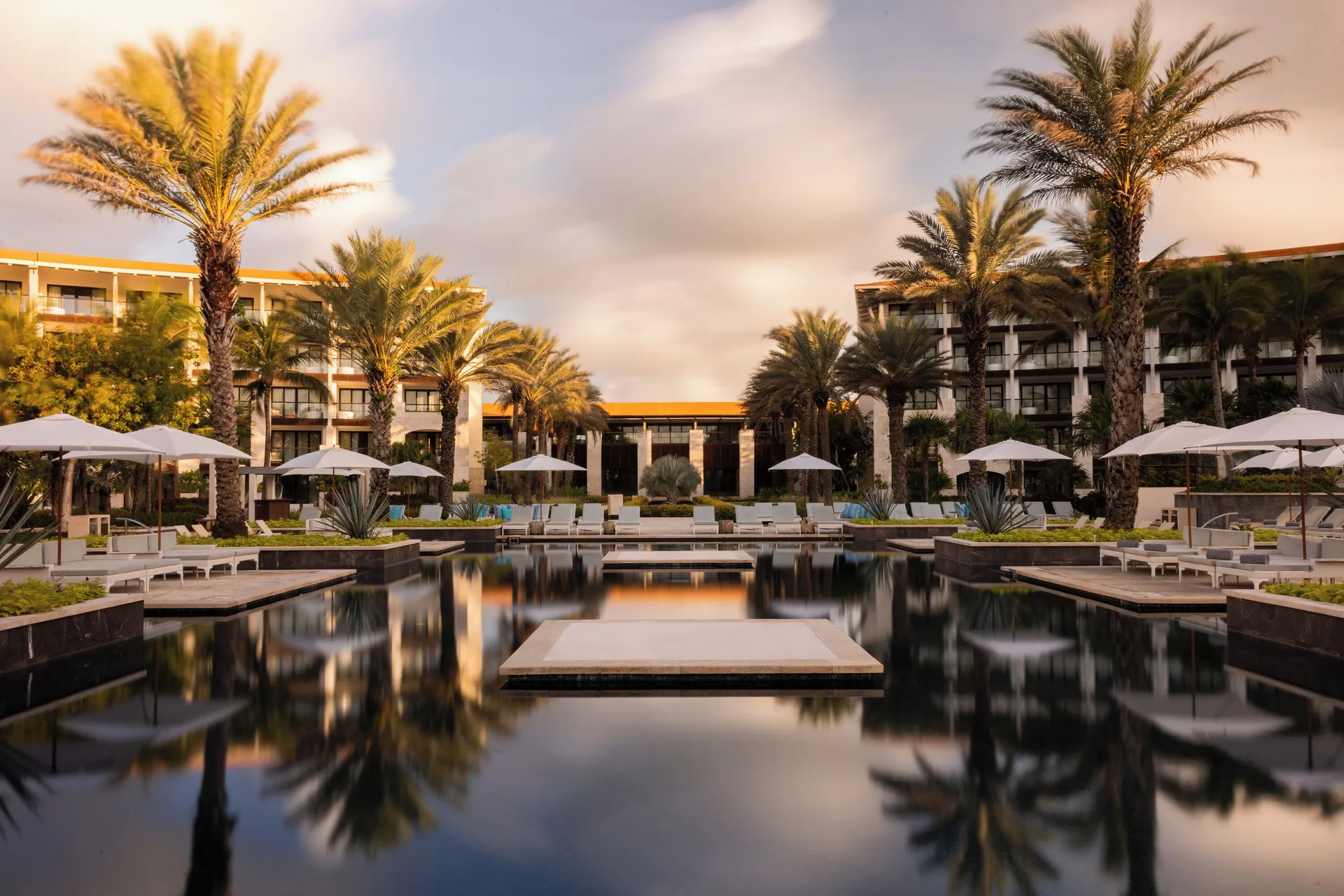 UNICO 20°87° Hotel Xpu-Ha adults-only all-inclusive resort with modern design, beachfront setting, and luxury amenities.
