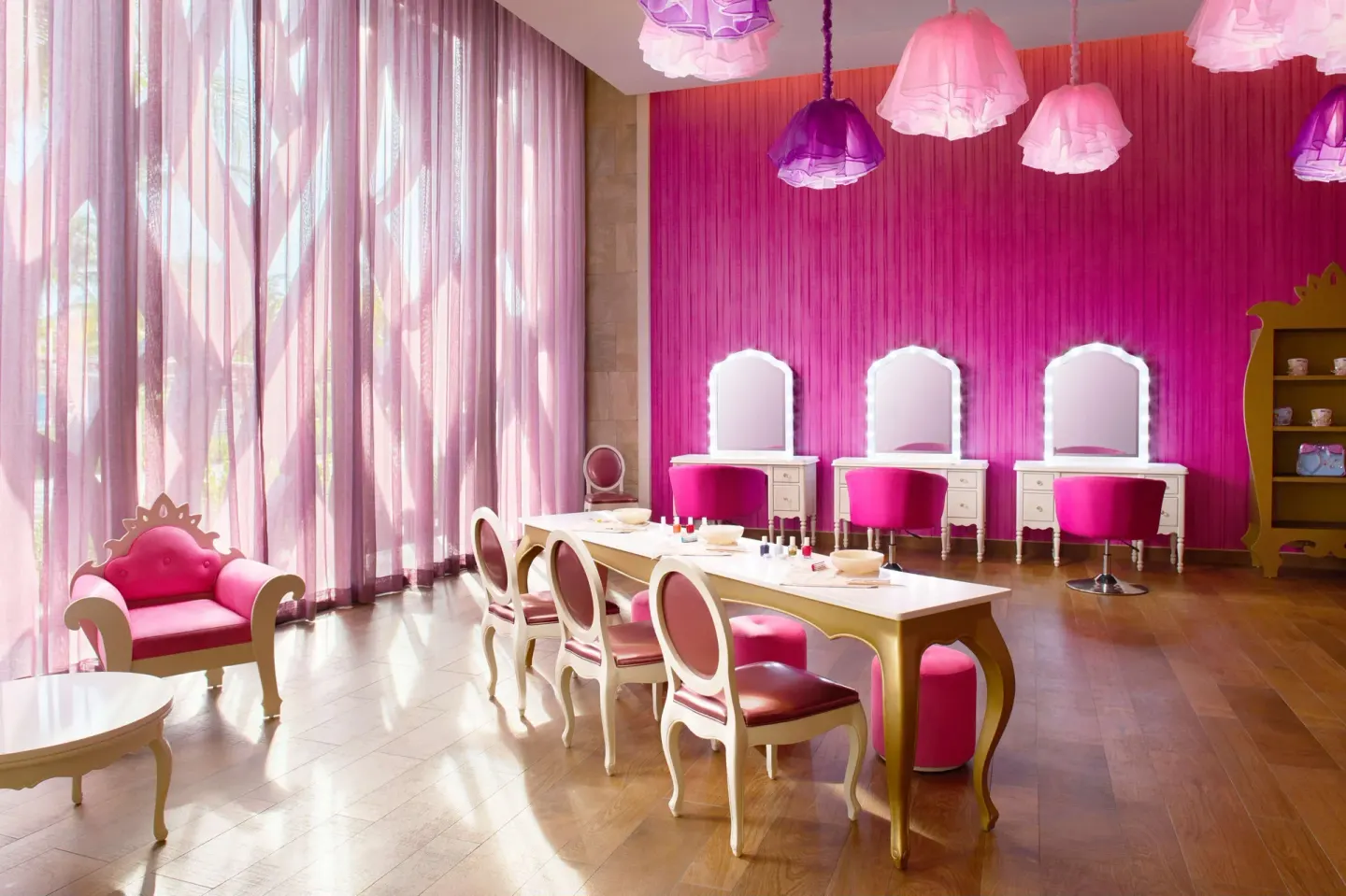 Pink children's beauty salon with vanity chairs at Barceló Maya Caribe.