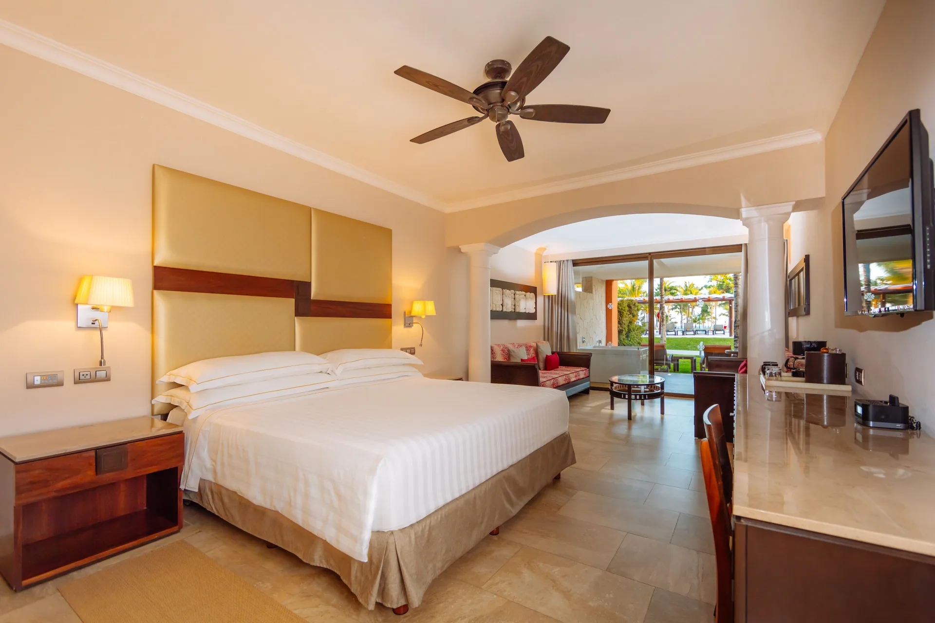 Junior Suite Ocean Front Premium Level with king bed and terrace doors at Barceló Maya Caribe.