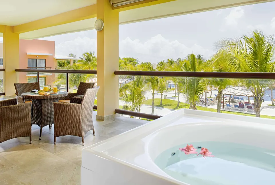 Ocean Front Premium Level suite balcony with whirlpool tub at Barceló Maya Caribe.