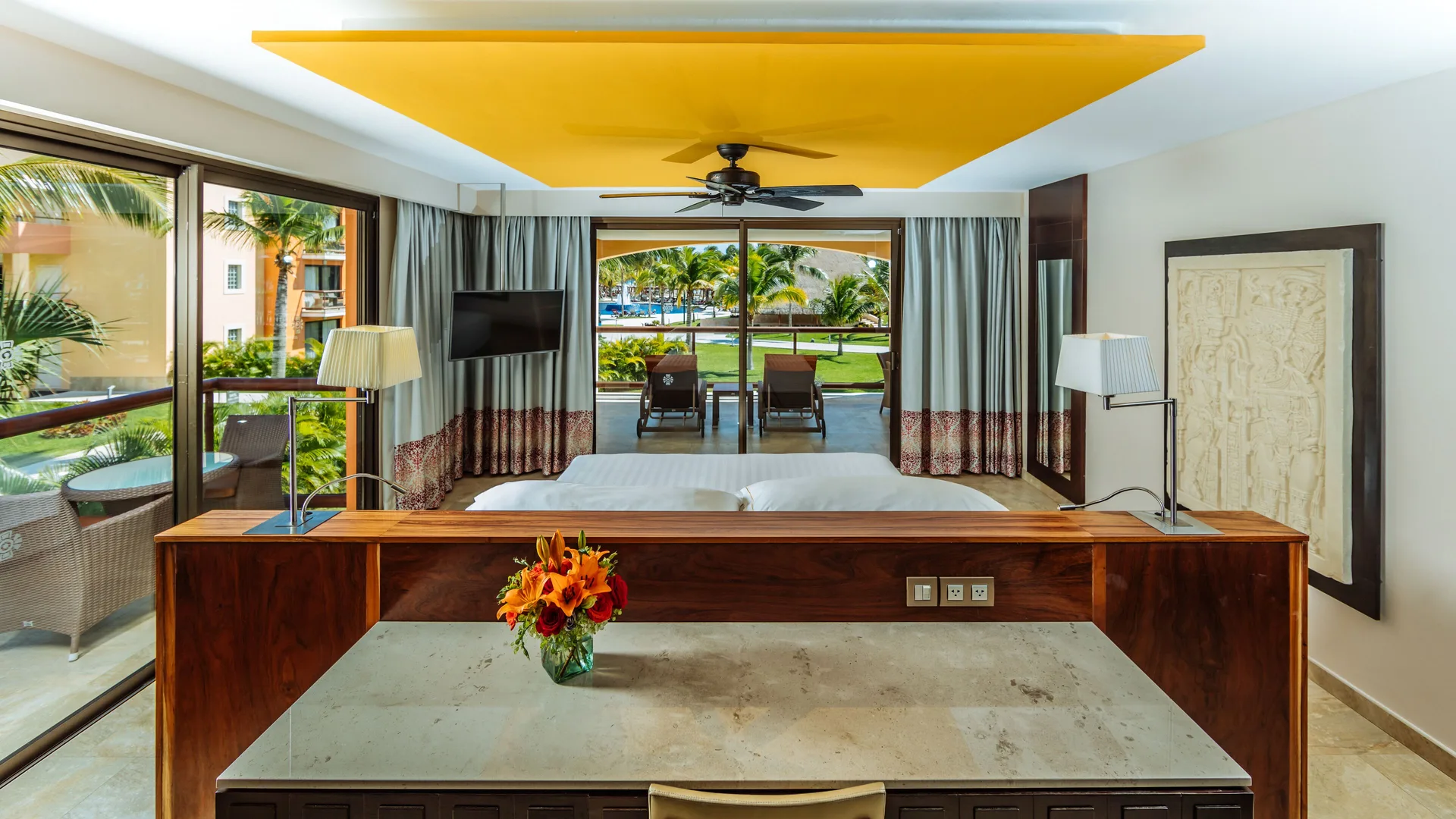 Ocean Front Premium Level suite bedroom and terrace view at Barceló Maya Caribe.
