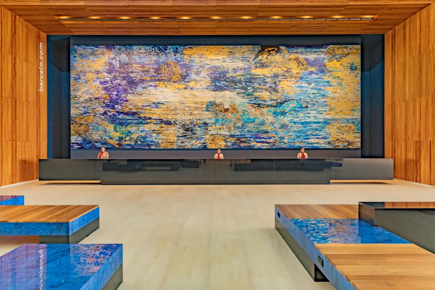 Reception desk and large abstract wall artwork in the lobby at Barceló Maya Riviera.