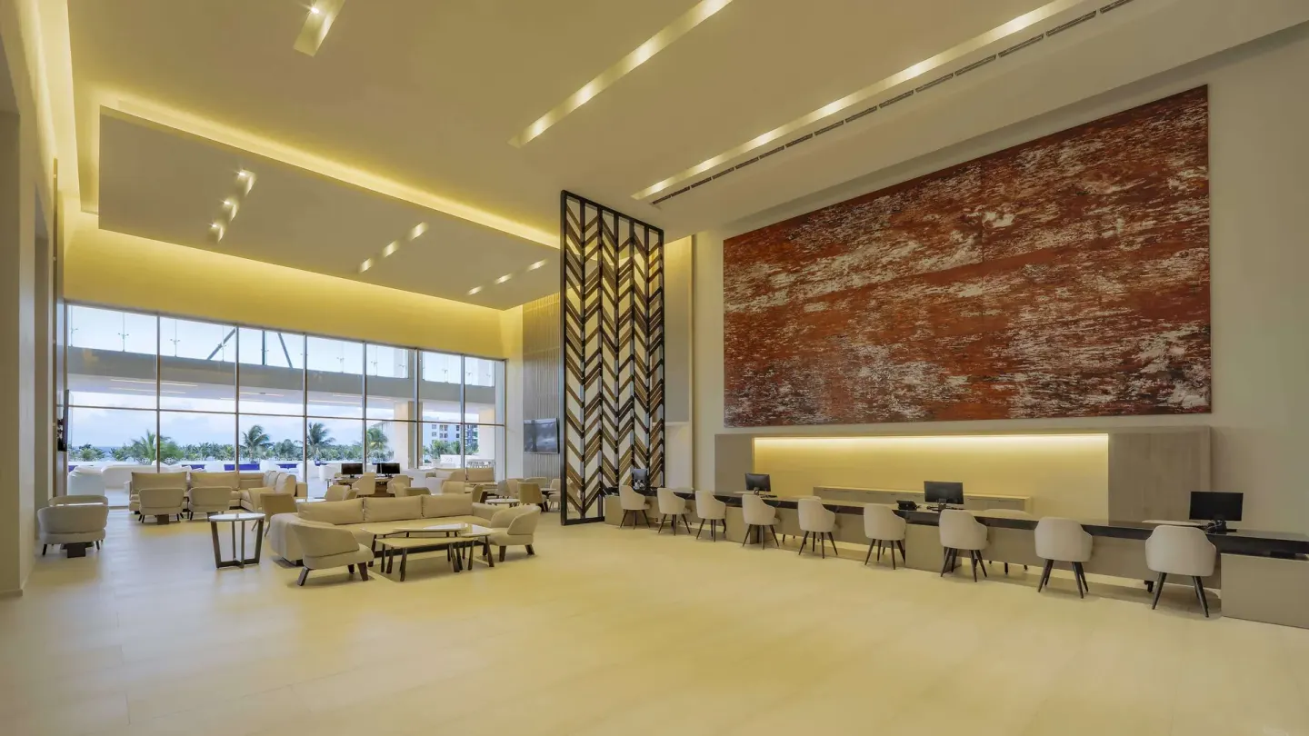 Spacious lobby seating and service desks at Barceló Maya Riviera.