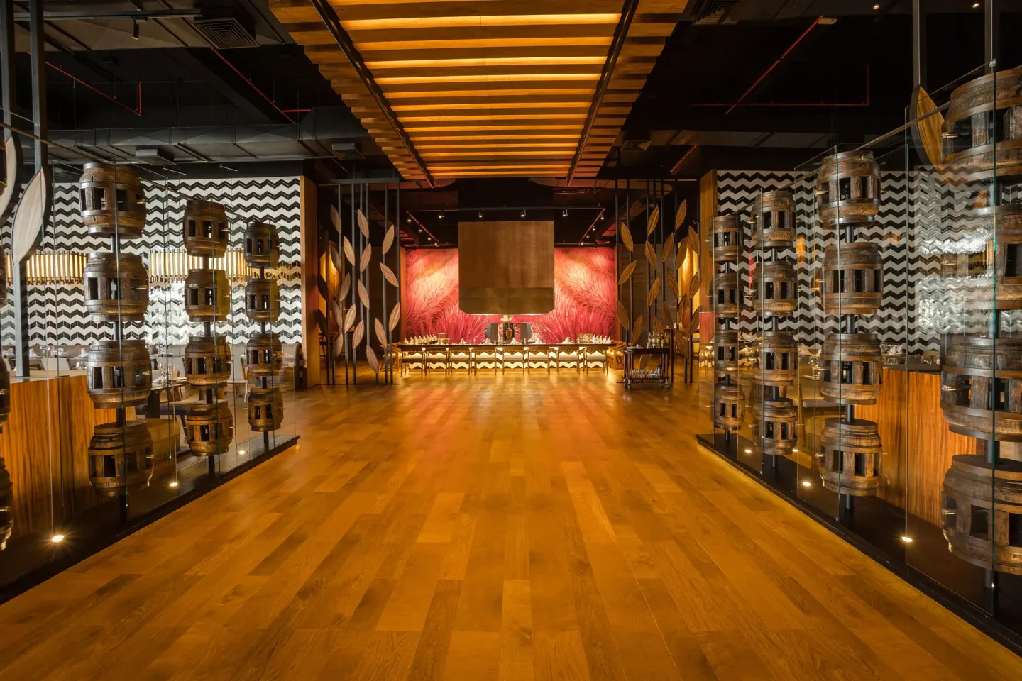 A dramatic restaurant entrance with glass displays at Barceló Maya Riviera.
