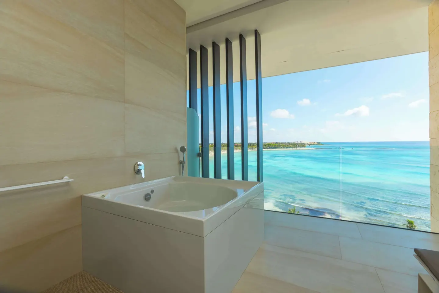 Oceanfront bathtub in a Junior Suite at Barceló Maya Riviera with turquoise sea views.