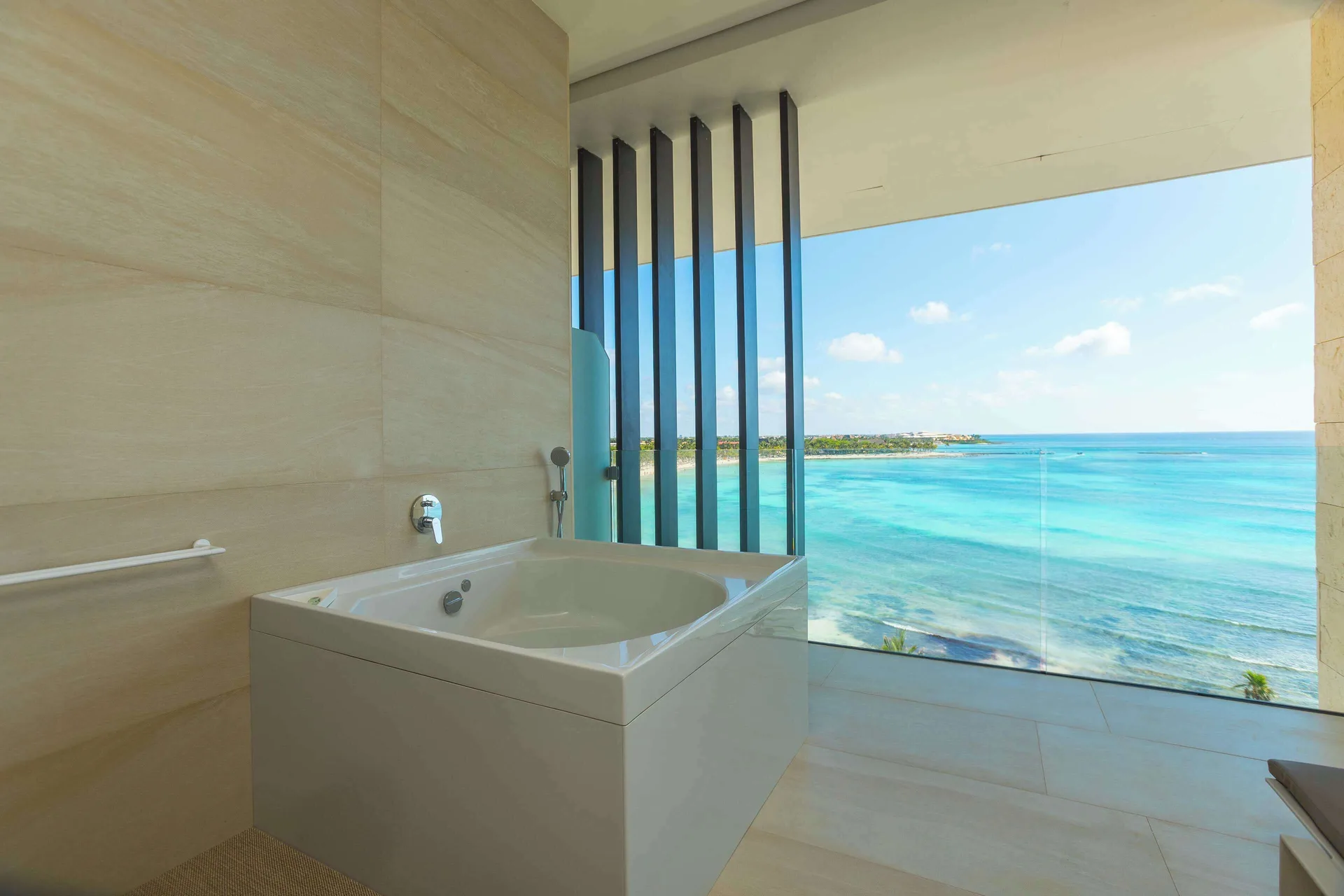 Oceanfront bathtub in a Junior Suite at Barceló Maya Riviera with turquoise sea views.