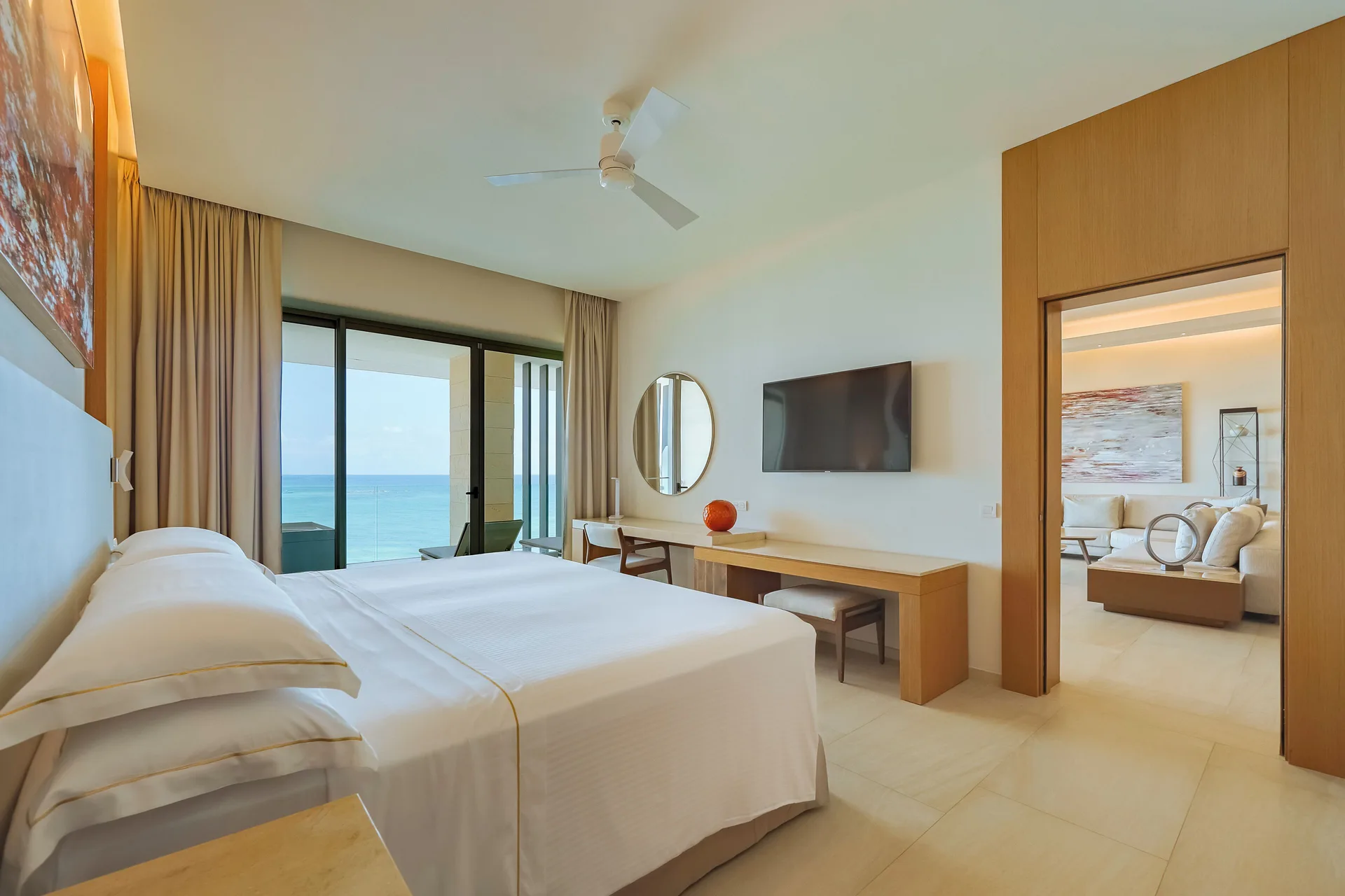 Presidential Suite oceanfront bedroom with king bed and sea view at Barceló Maya Riviera.
