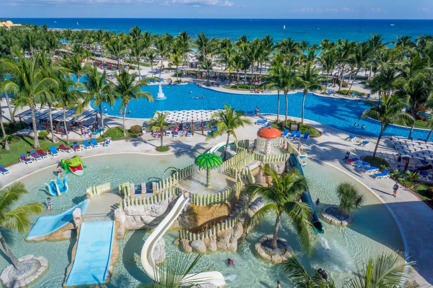 An aerial view shows the kids' water area and beachfront pools at Barceló Maya Tropical.