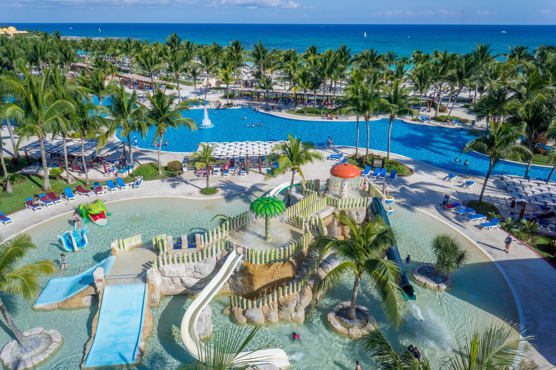 An aerial view shows the kids' water area and beachfront pools at Barceló Maya Tropical.