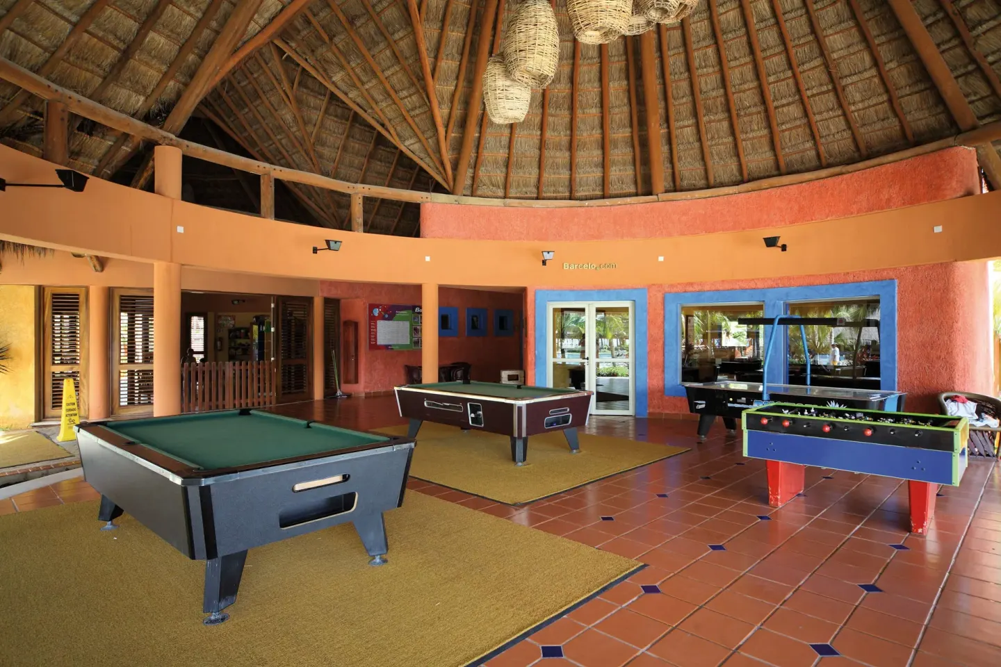 Open-air game area with billiards and foosball tables at Barceló Maya Tropical.