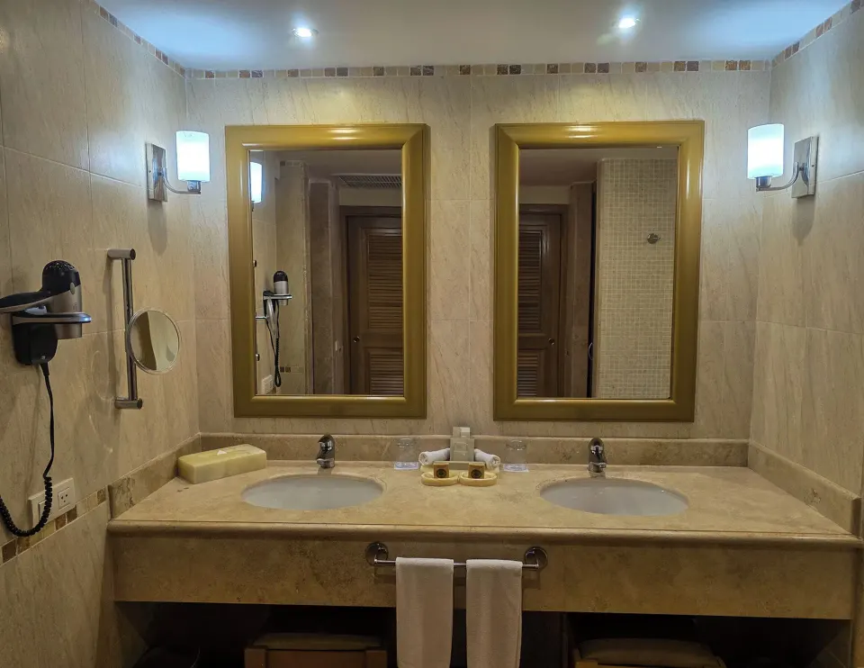 Superior Room bathroom double vanity and wall mirrors at Barceló Maya Tropical.