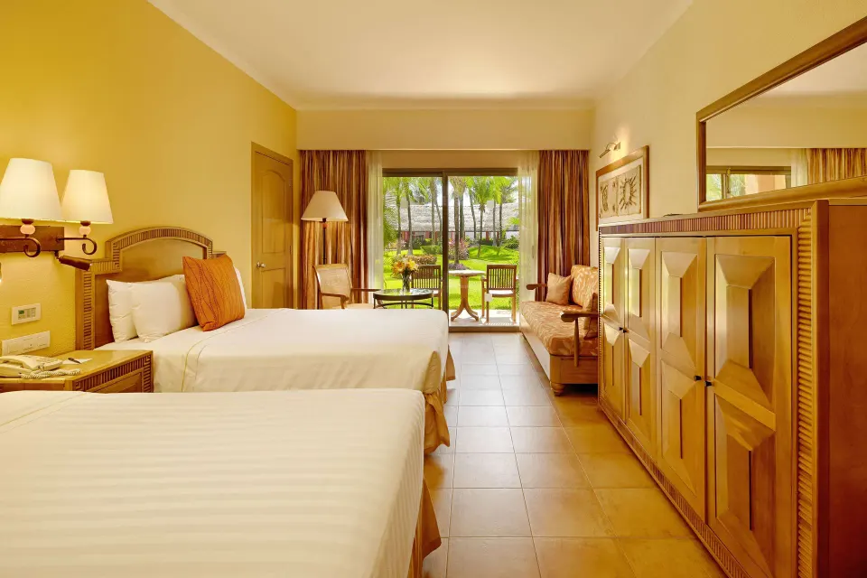 Superior Room with two beds and garden-facing patio at Barceló Maya Tropical.