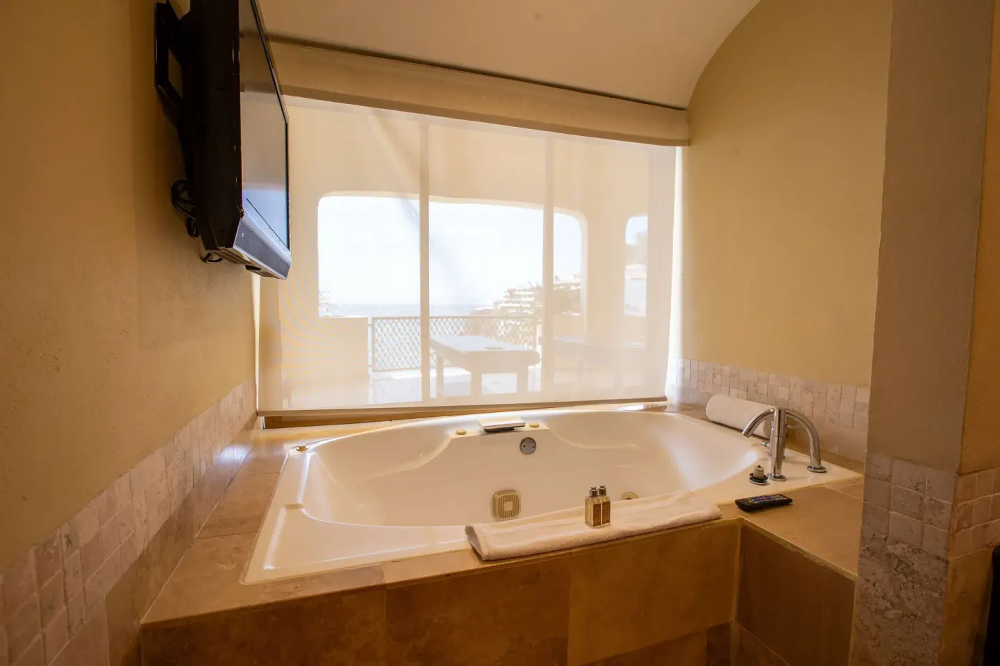 Bathroom soaking tub with a terrace view at Barceló Puerto Vallarta.