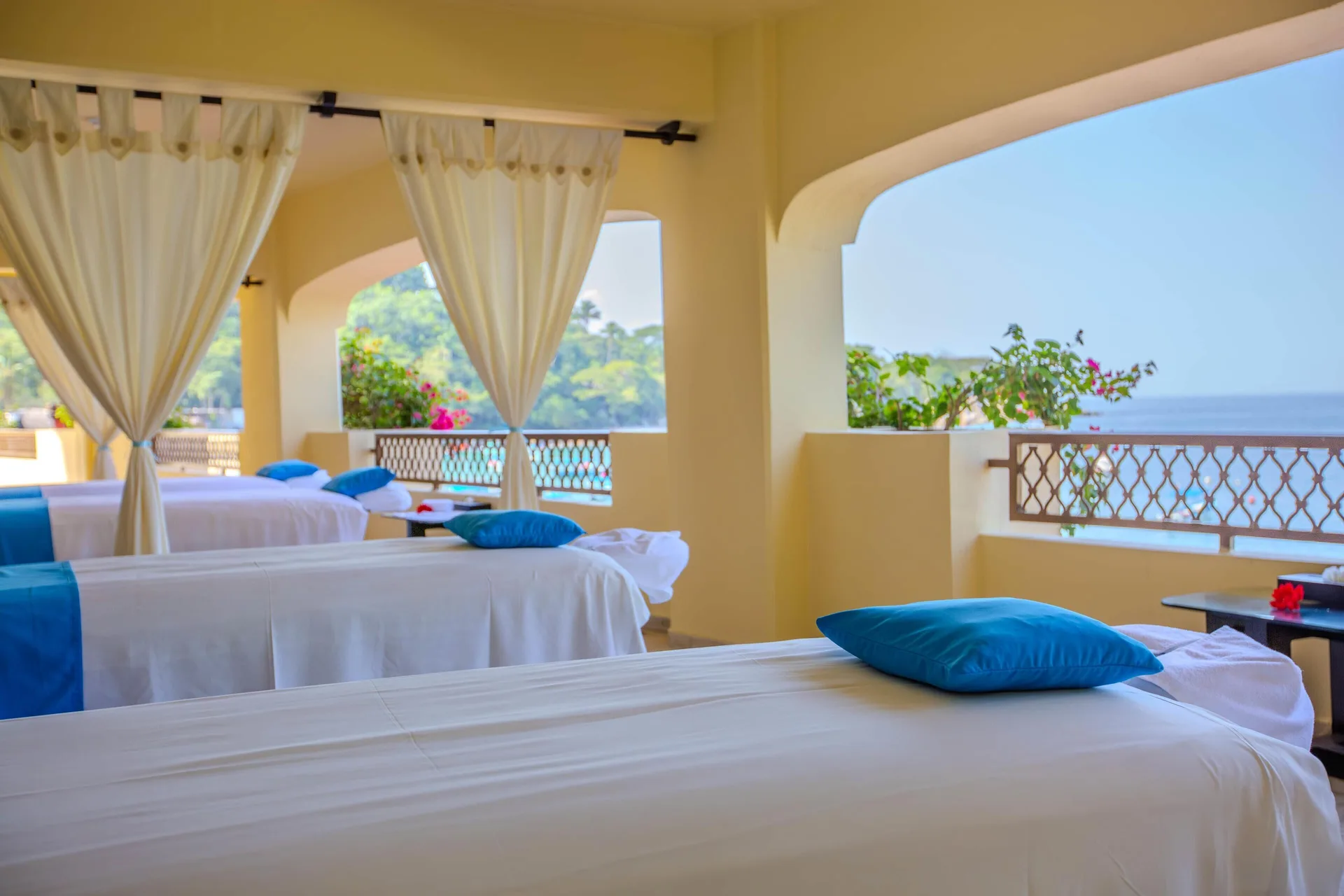 Open-air spa treatment beds facing the ocean at Barceló Puerto Vallarta.