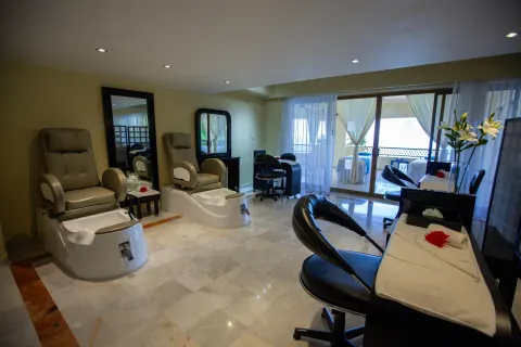Spa pedicure room with treatment chairs and manicure stations at Barceló Puerto Vallarta.