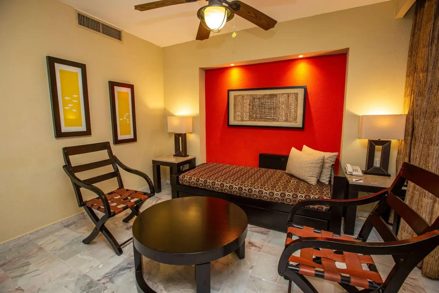 Deluxe Suite Premium Level sitting area with daybed at Barceló Puerto Vallarta.