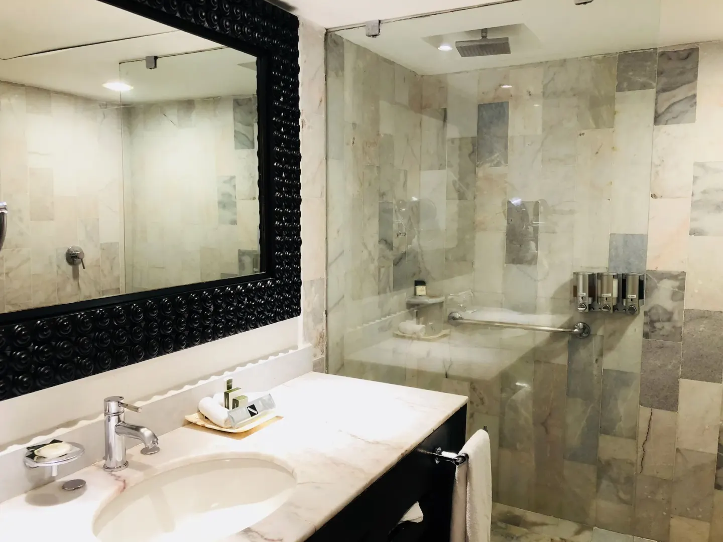 Deluxe Suite bathroom vanity and glass shower at Barceló Puerto Vallarta.