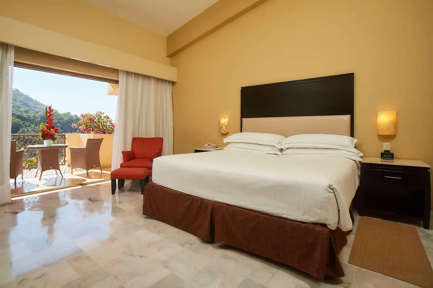 Family Room Premium Level king bed and balcony at Barceló Puerto Vallarta.