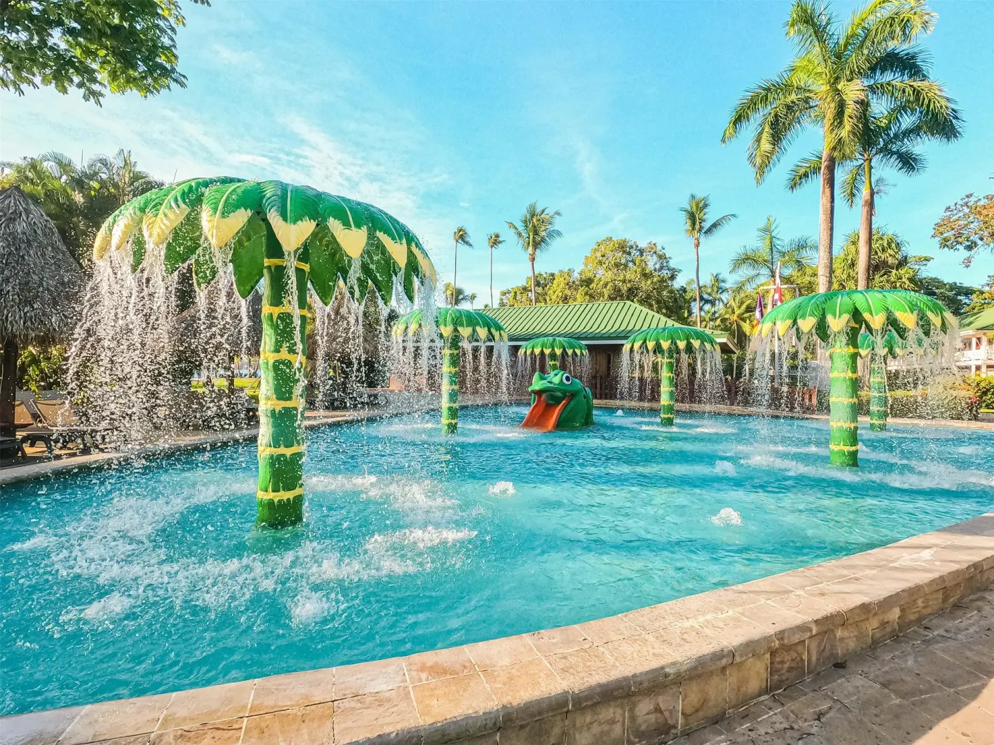 Children's splash pool with palm-shaped fountains at Barceló Tambor.