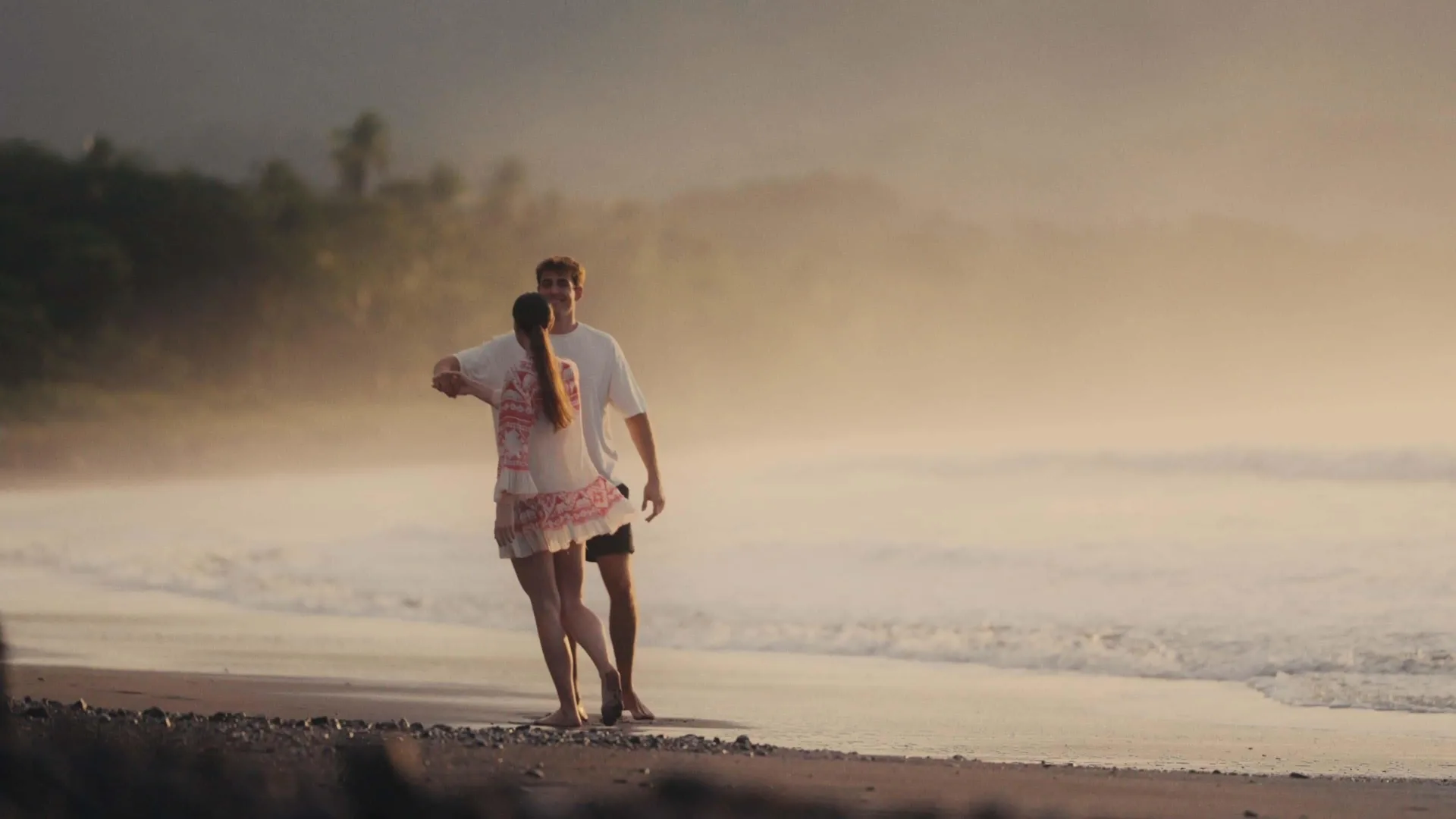 Couple embracing beside the ocean at dusk at Barceló Tambor.