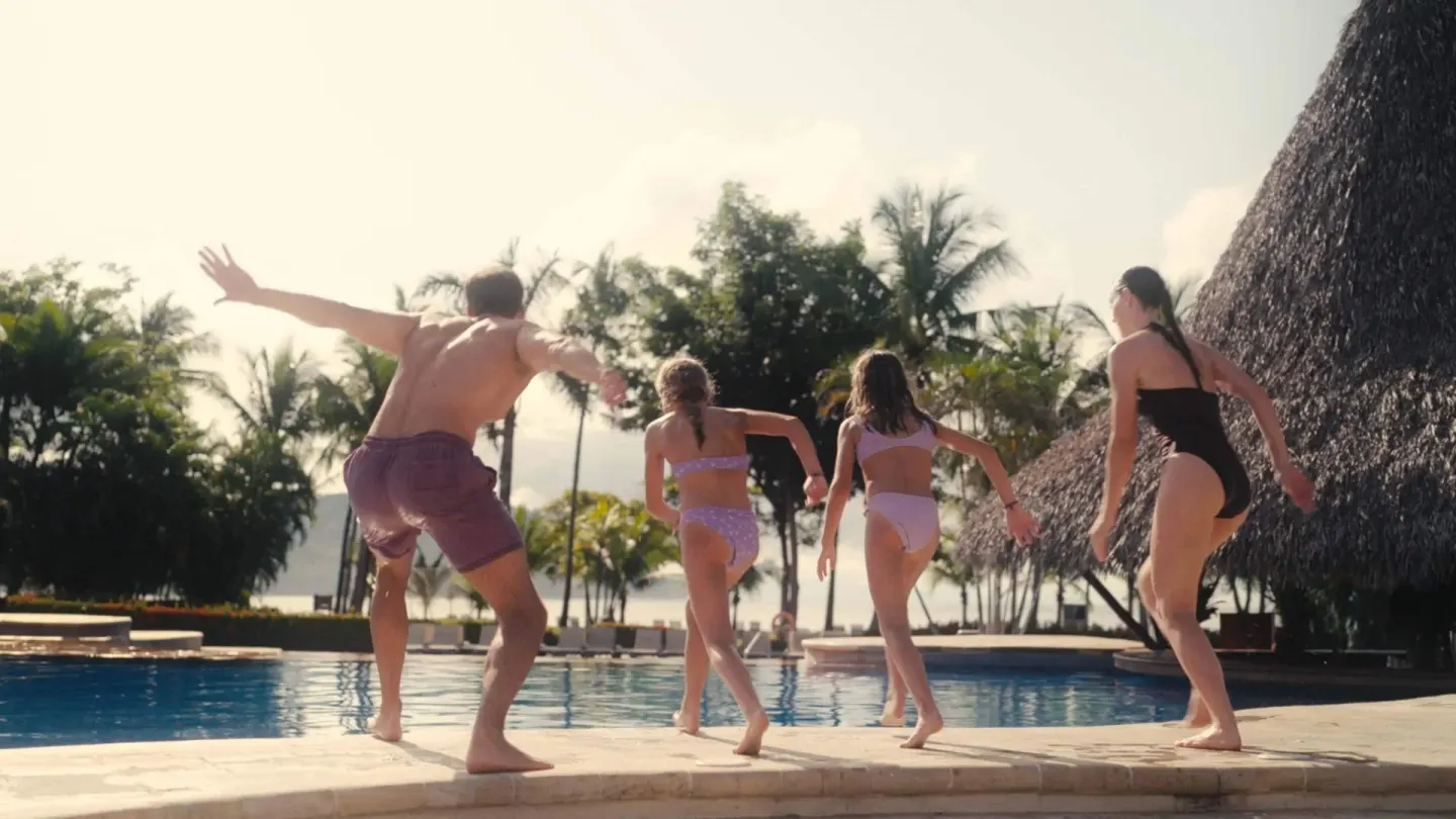 Family running toward the swimming pool at Barceló Tambor.