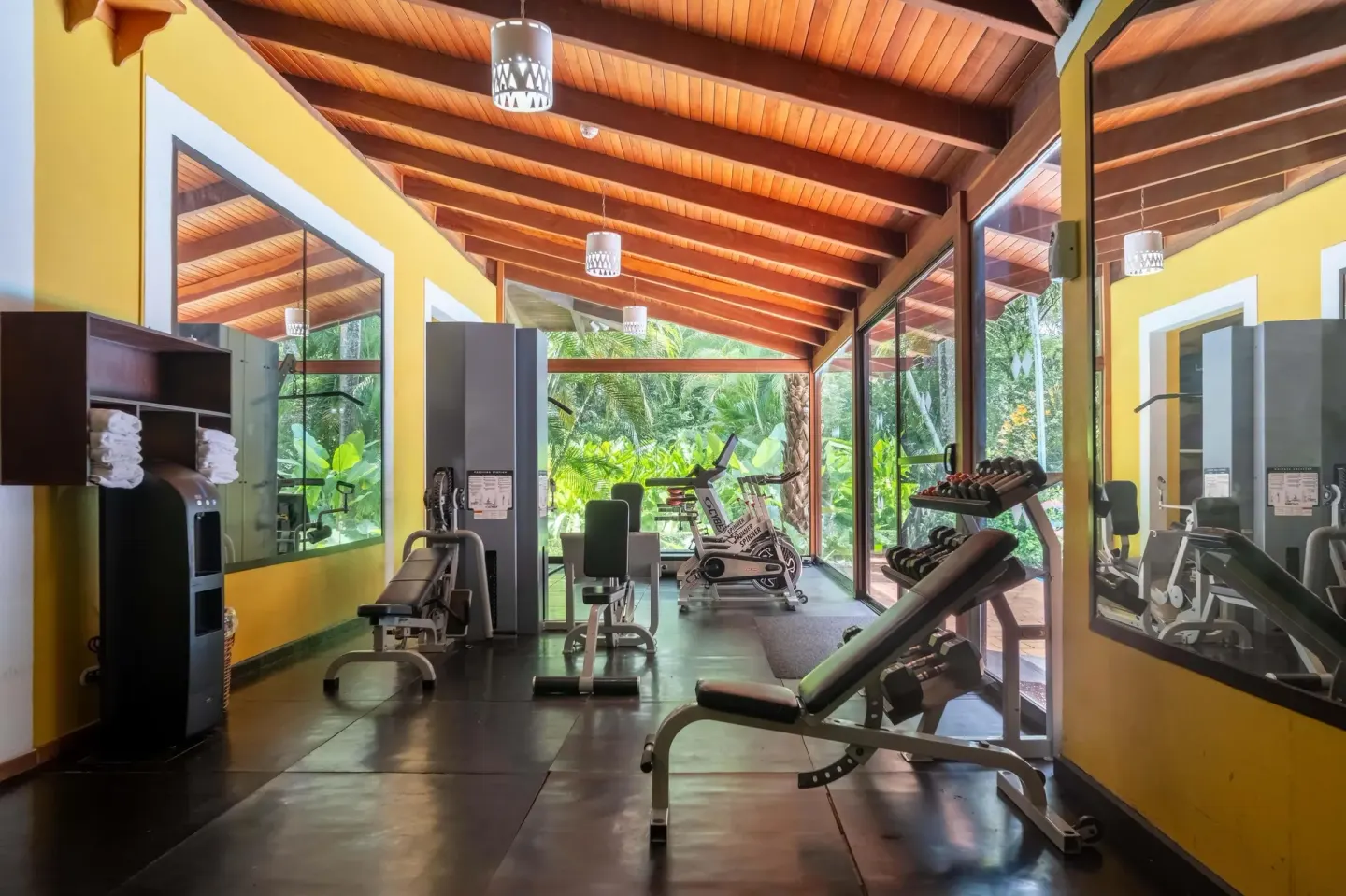 Fitness center with benches, weights, and mirrors at Barceló Tambor.
