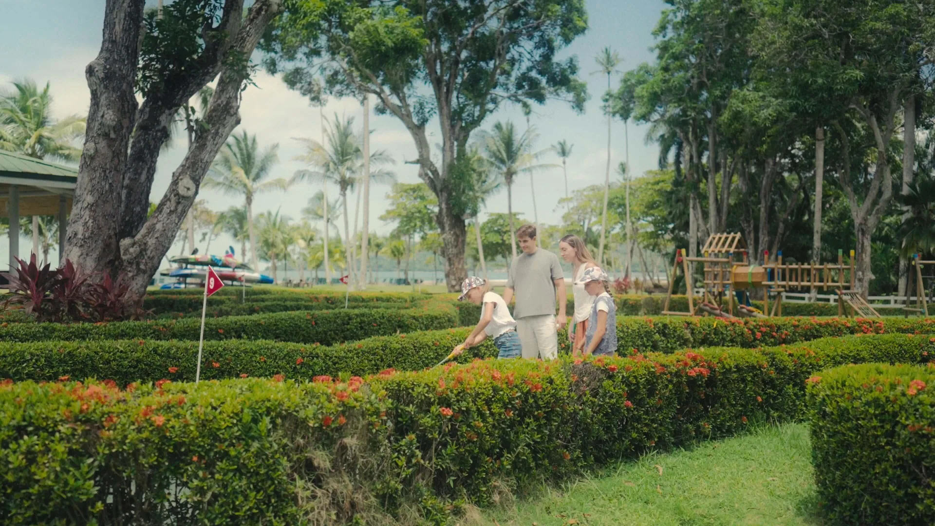Family plays mini golf in the tropical gardens at Barceló Tambor.