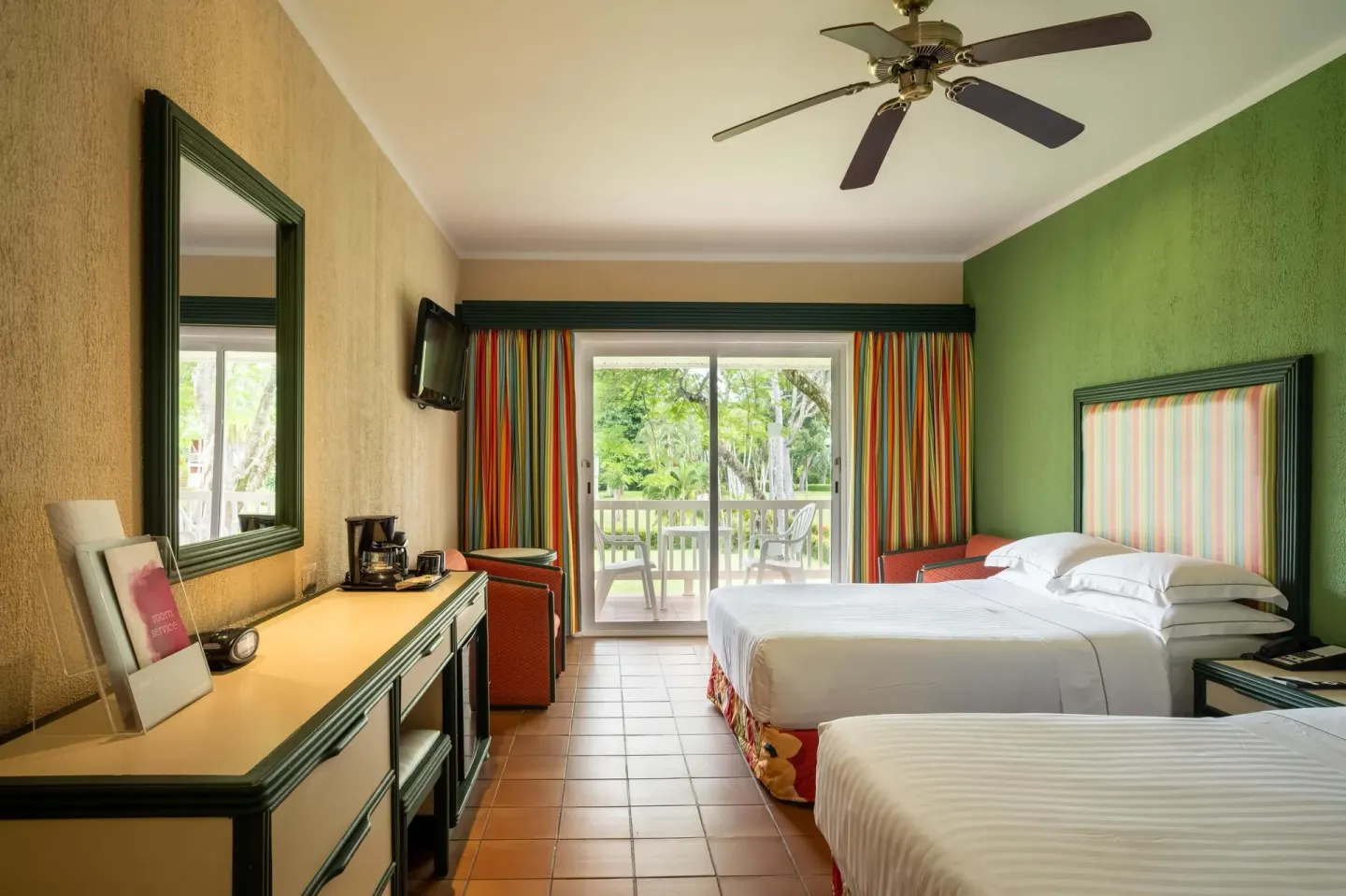 Superior Room with two beds, desk area, and balcony at Barceló Tambor.