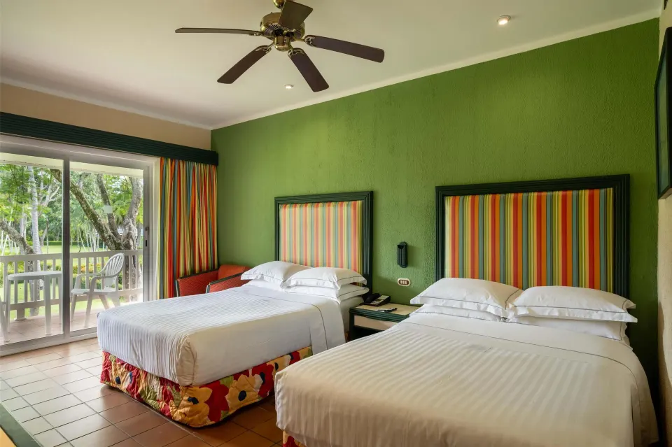Superior Room with two beds and a balcony facing greenery at Barceló Tambor.