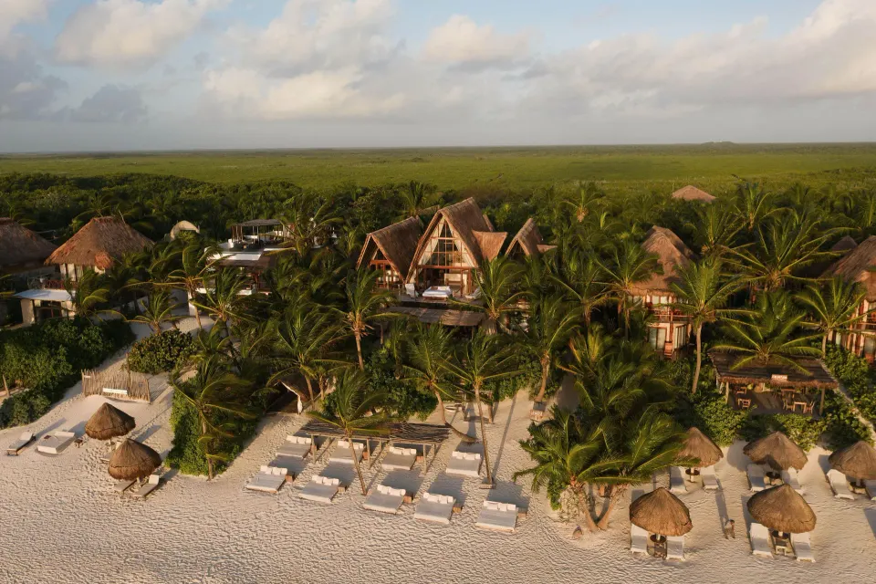 La Valise Tulum intimate luxury boutique hotel with beachfront suite and palm-framed ocean view in Tulum, Mexico.