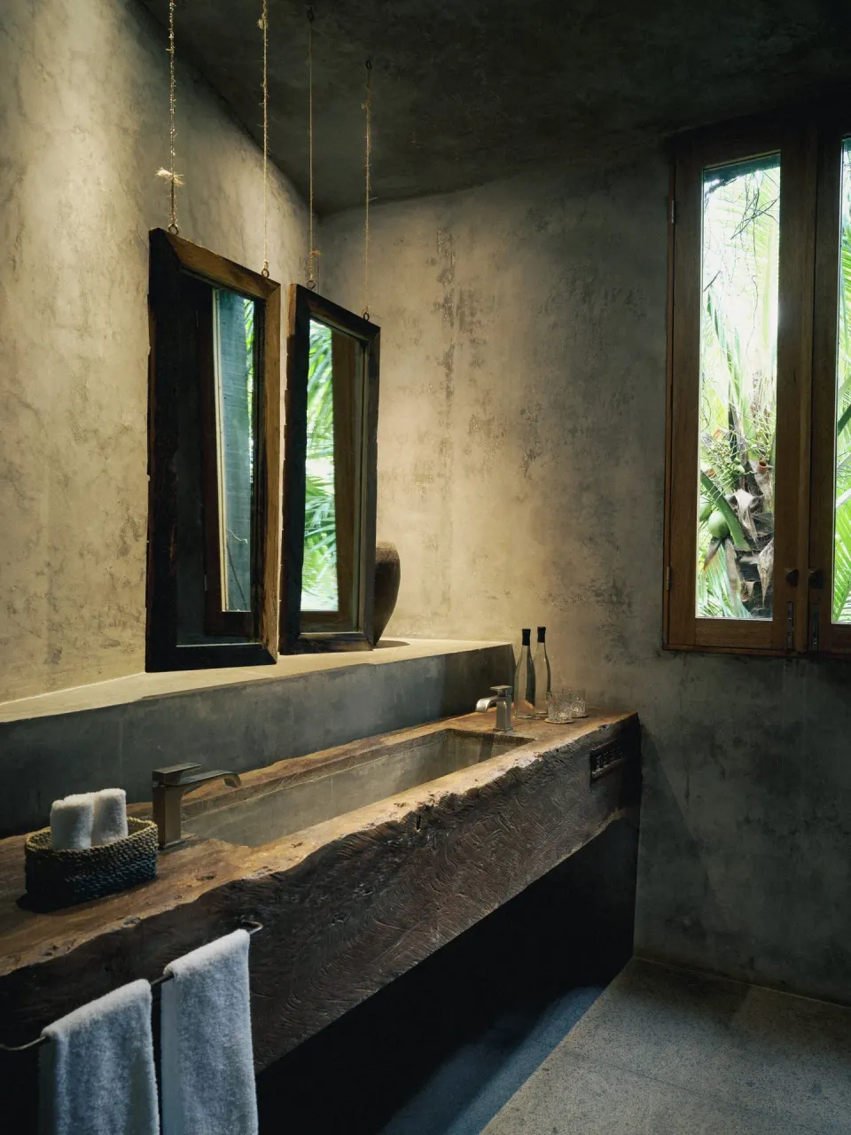 Rustic wood vanity and double mirror bathroom at BE Destination Tulum
