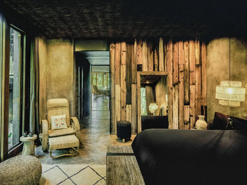 Premier Suite Oceanfront bedroom looking toward hallway and seating area at BE Destination Tulum