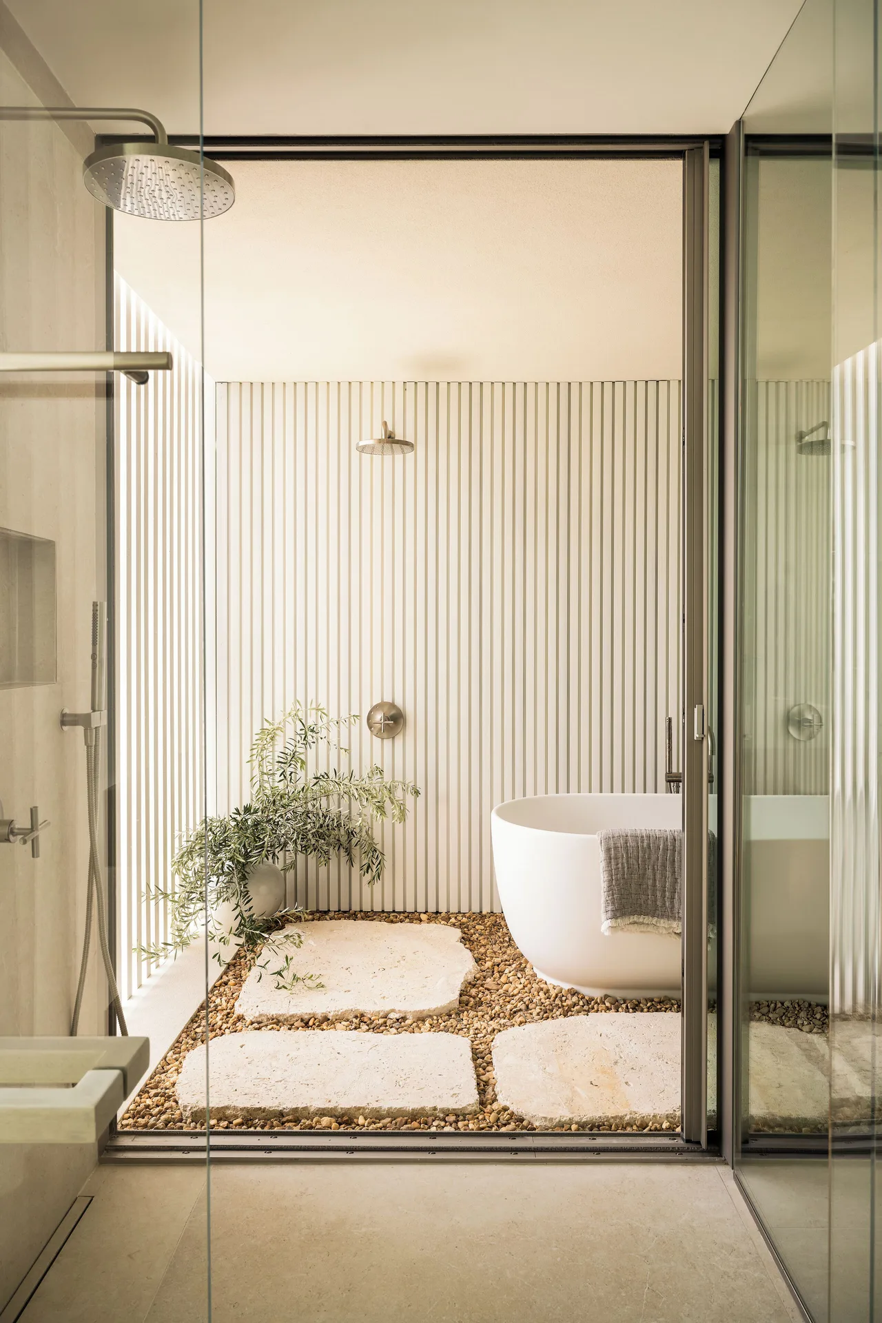 Bathroom with soaking tub and private courtyard at Long Bay Ambra Beach Club Connecting Room at Beach Enclave with elegant design in Turks and Caicos.