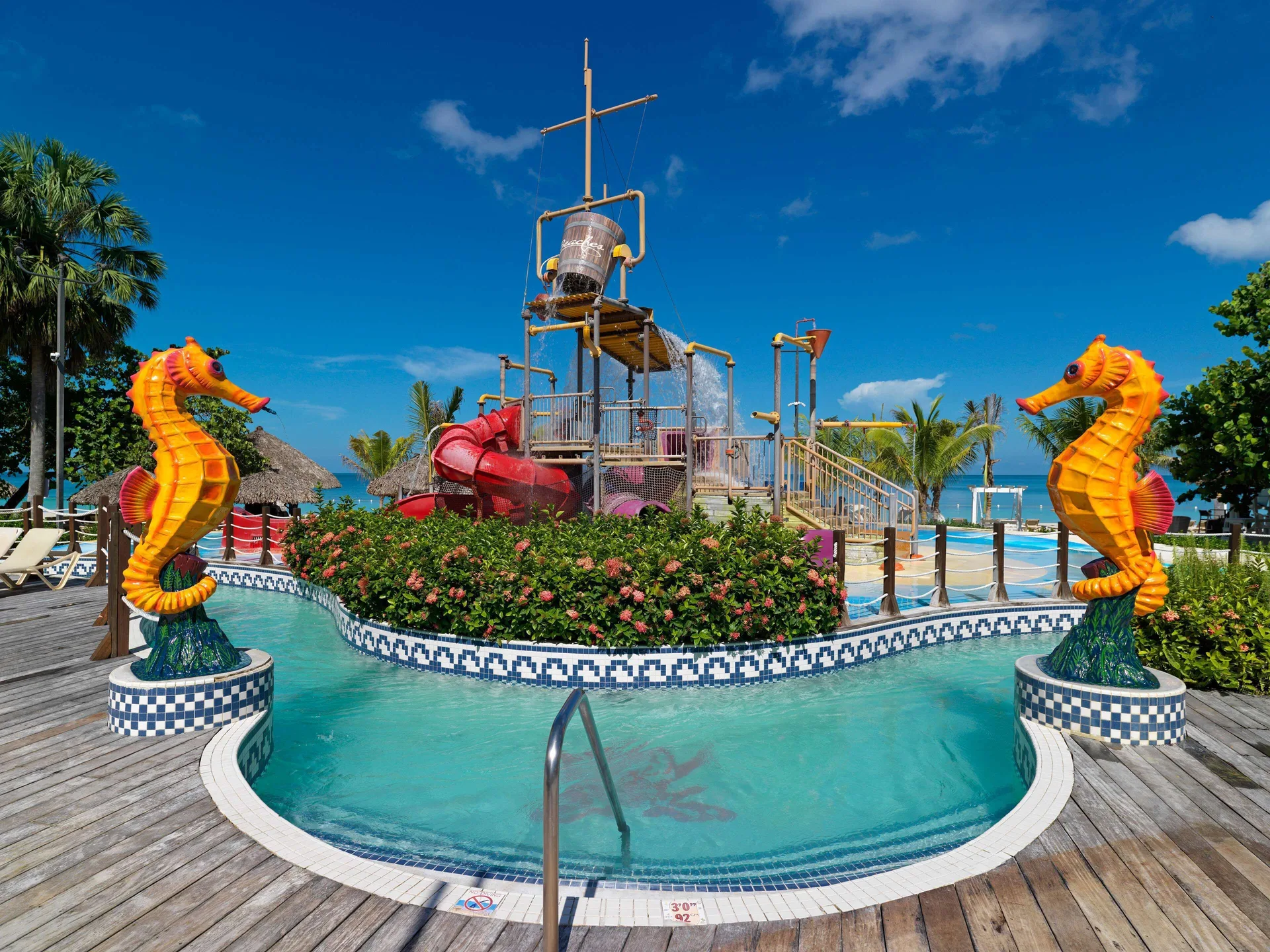 Children’s water play area with seahorse statues at Beaches Negril Resort.