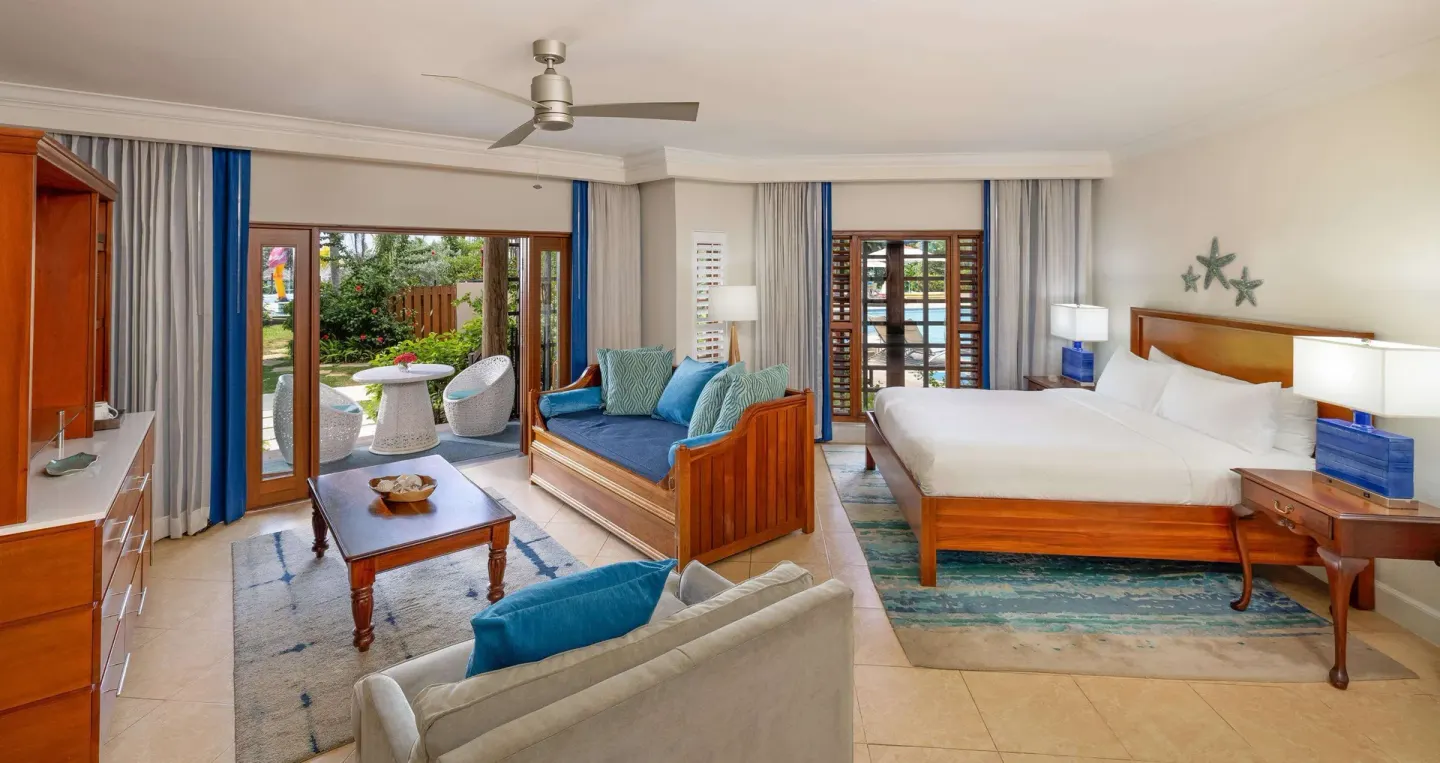 Spacious king room with sitting area and patio access at Beaches Negril Resort.