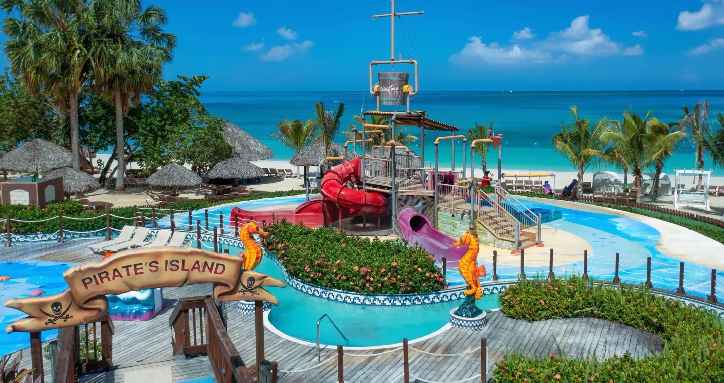 Pirate-themed water play area beside the beach at Beaches Negril Resort.