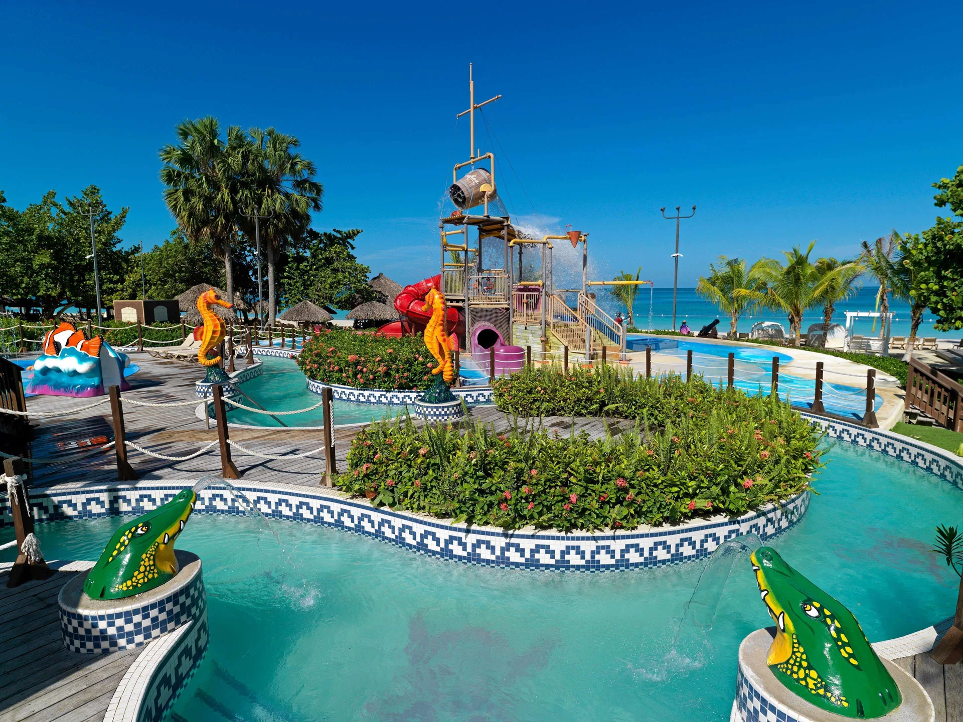 Pirate water play structure and shallow pool near the ocean at Beaches Negril Resort.