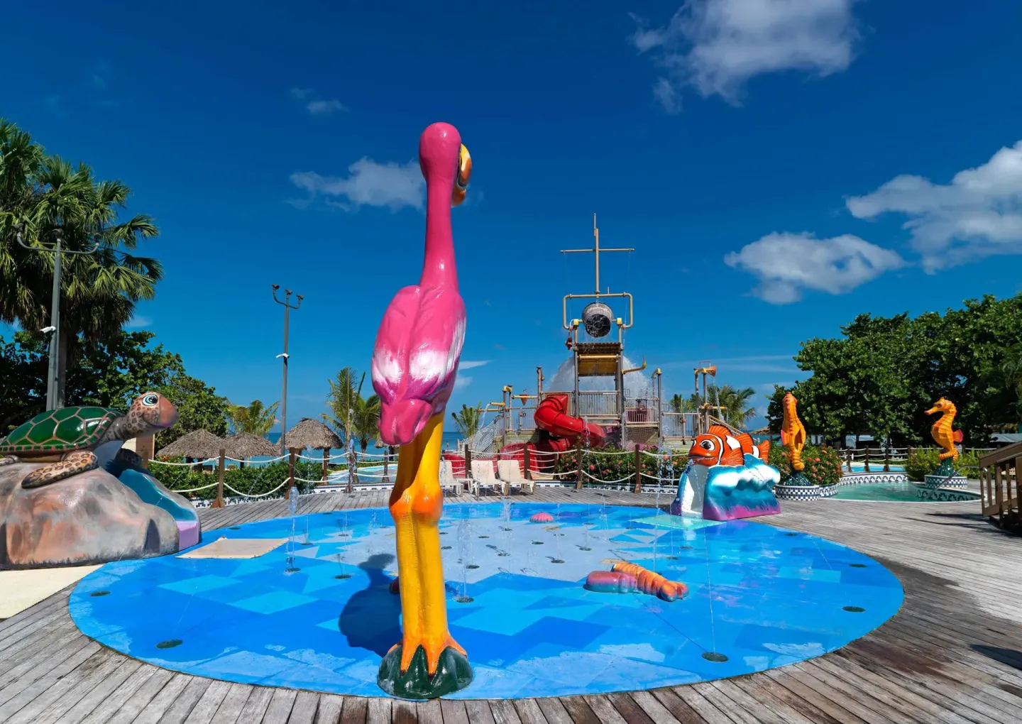 Splash pad with animal figures and a pirate play tower at Beaches Negril Resort.