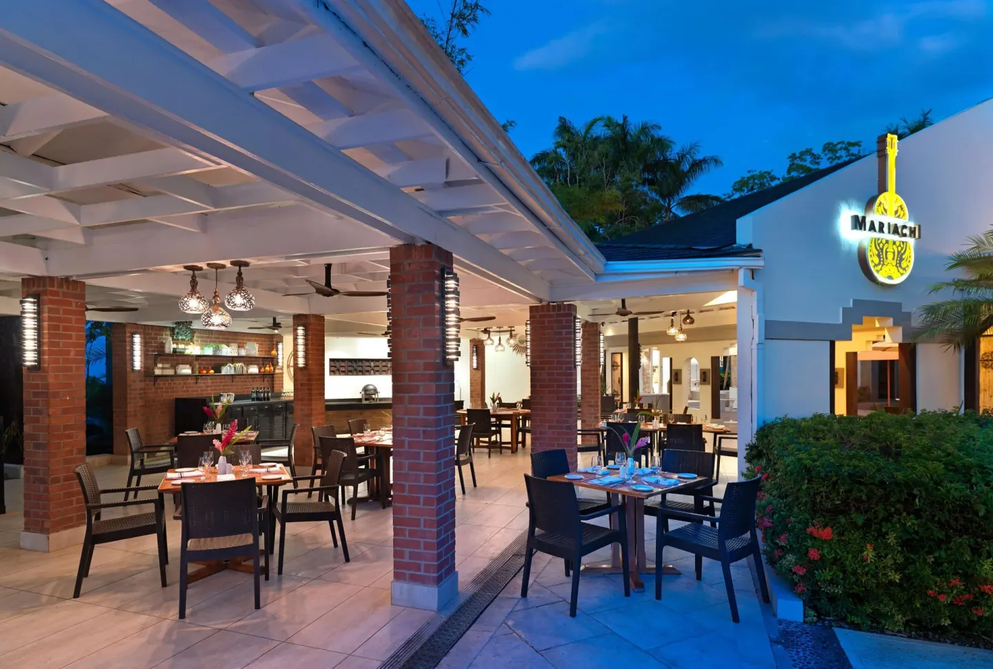 El Mariachi restaurant patio with illuminated sign at Beaches Negril Resort.