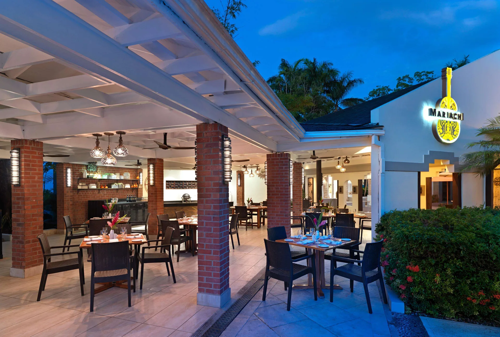 El Mariachi restaurant patio with illuminated sign at Beaches Negril Resort.