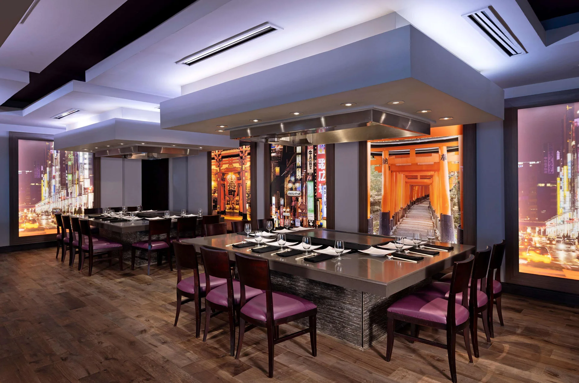 Teppanyaki tables with griddle counters and Japanese wall imagery at Beaches Negril Resort.