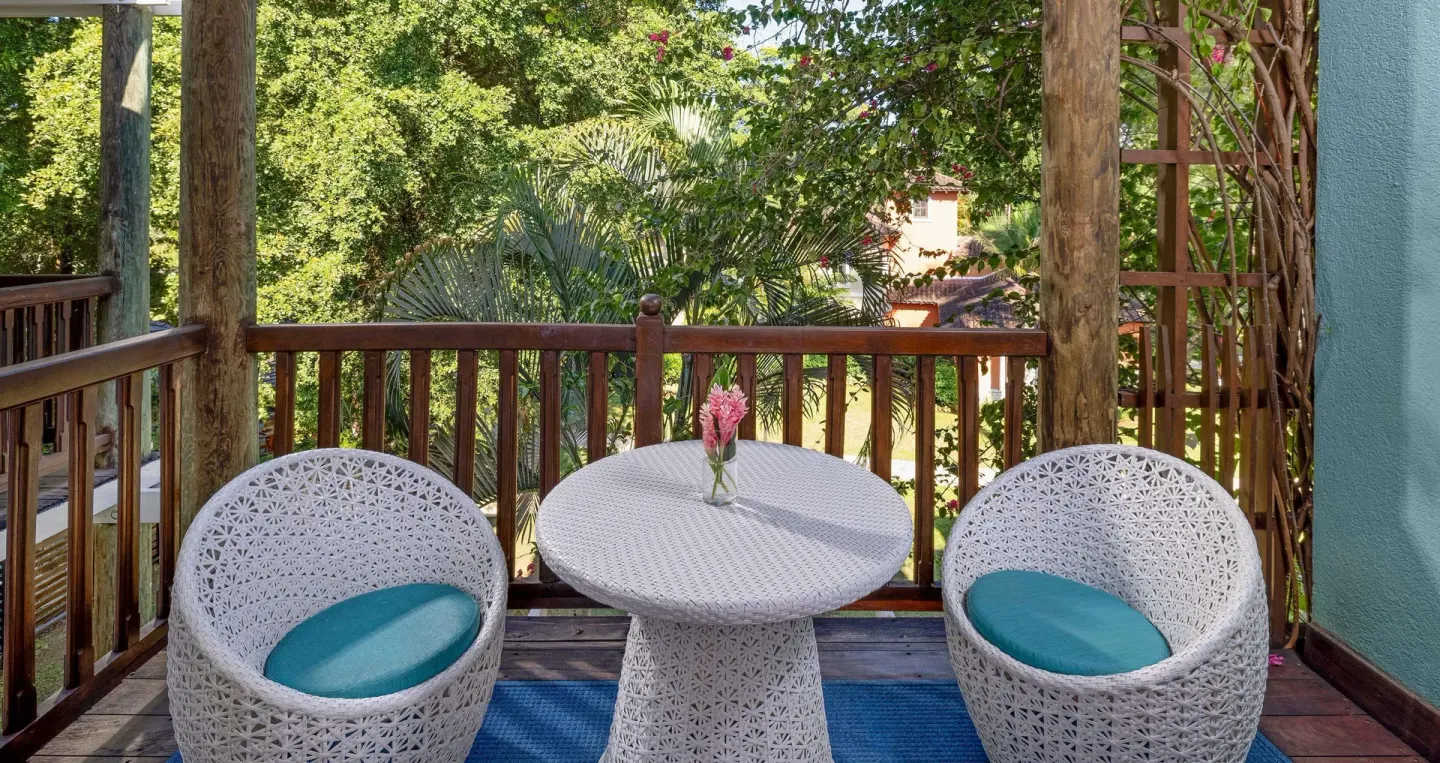 Garden-view balcony seating for a family room at Beaches Negril Resort.