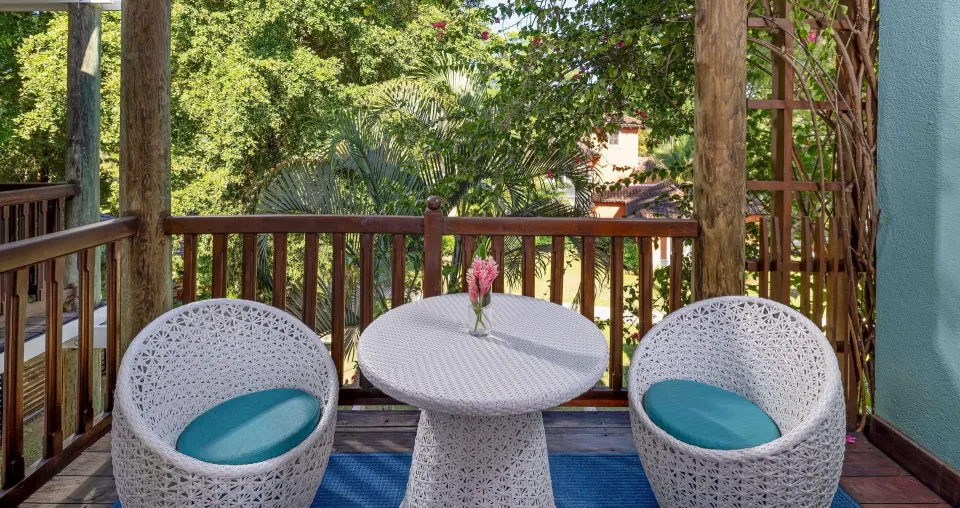 Garden-view balcony seating for a family room at Beaches Negril Resort.