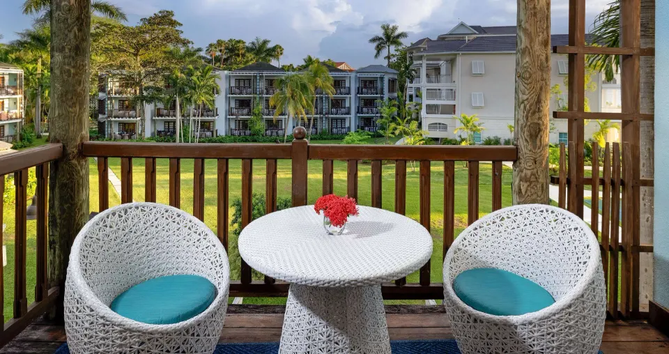 Furnished balcony with garden and resort-building views at Beaches Negril Resort.